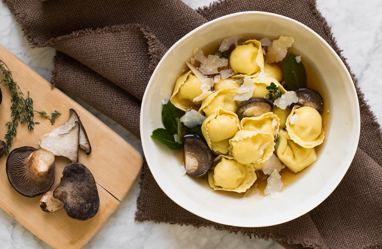 Mushroom & Mascarpone Tortelloni in mushroom broth with Parmigiano
