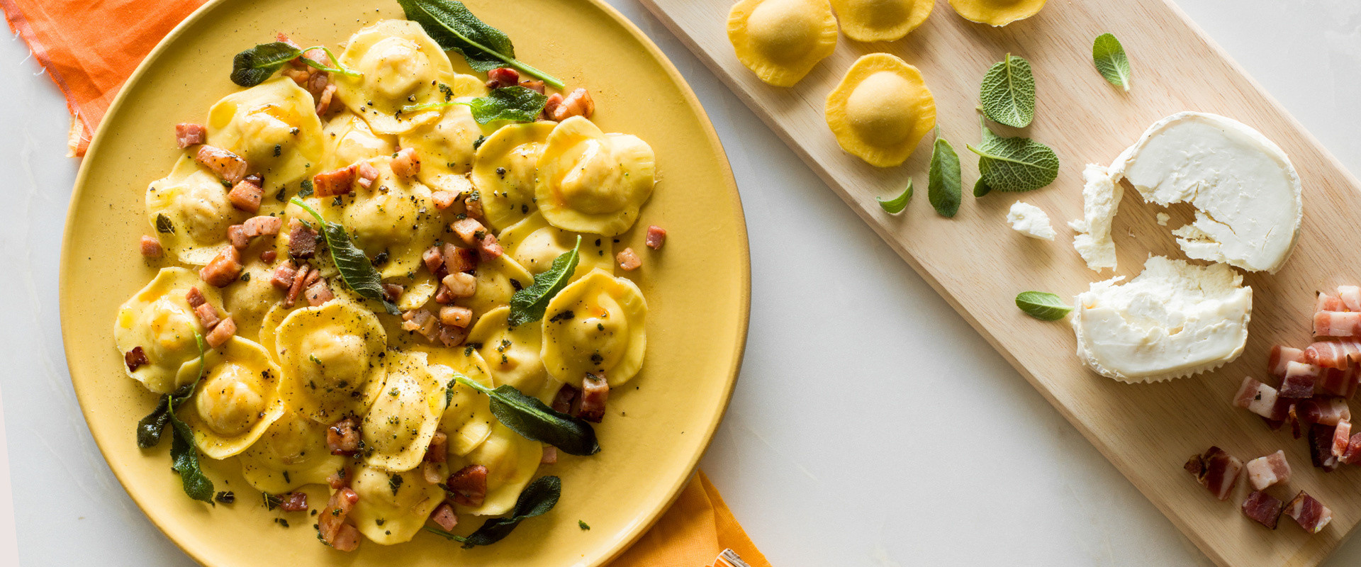 PUMPKIN & ROASTED ONION RAVIOLI WITH BACON, CRISPY SAGE AND GOAT’S